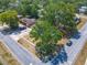 Birds eye view of a home on a corner lot with mature trees and landscaping at 1298 Scottsdale Dr, Ormond Beach, FL 32174