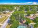 An aerial view of the home, pool, and landscaped backyard in a quiet neighborhood at 1298 Scottsdale Dr, Ormond Beach, FL 32174