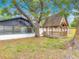 Secluded backyard featuring a charming gazebo, mature trees, and lush green space at 1298 Scottsdale Dr, Ormond Beach, FL 32174