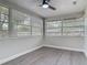 This bedroom features wood-look floors, fresh paint, and lots of natural light at 1298 Scottsdale Dr, Ormond Beach, FL 32174