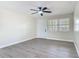 Bedroom with a ceiling fan and a window providing natural light at 1298 Scottsdale Dr, Ormond Beach, FL 32174