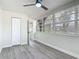 This bedroom features wood-look floors, fresh paint, and closet at 1298 Scottsdale Dr, Ormond Beach, FL 32174
