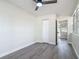 This bedroom features wood-look floors, fresh paint, and a closet at 1298 Scottsdale Dr, Ormond Beach, FL 32174