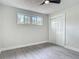 Well-lit bedroom with new flooring, closet and updated trim for a modern and comfortable feel at 1298 Scottsdale Dr, Ormond Beach, FL 32174