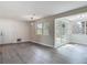 Dining room with modern light fixture, gray wood flooring and windows with plenty of natural light at 1298 Scottsdale Dr, Ormond Beach, FL 32174