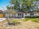 Lovely home with updated front yard landscaping and a blooming Crape Myrtle at 1298 Scottsdale Dr, Ormond Beach, FL 32174