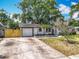 Beautiful single story home with a freshly painted exterior and lush landscaping at 1298 Scottsdale Dr, Ormond Beach, FL 32174