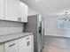 This kitchen features white cabinets, stainless steel appliances, and lots of counter space at 1298 Scottsdale Dr, Ormond Beach, FL 32174