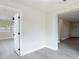 This living room has gray wood-look floors and fresh paint at 1298 Scottsdale Dr, Ormond Beach, FL 32174