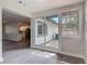 Sun room with view of kitchen and deck through sliding glass doors at 1298 Scottsdale Dr, Ormond Beach, FL 32174
