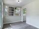 Bright sun room with large window and hardwood floor at 1298 Scottsdale Dr, Ormond Beach, FL 32174