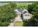 Aerial view of a home with solar panels and mature trees in the backyard at 1302 Shelter Rock Rd, Orlando, FL 32835