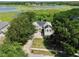 Aerial view of home with solar panels, mature trees and a large green backyard at 1302 Shelter Rock Rd, Orlando, FL 32835