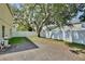 A shady backyard includes a white fence and mature trees at 1302 Shelter Rock Rd, Orlando, FL 32835
