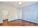 Bedroom featuring wood floors, painted accent wall, ceiling fan and closet at 1302 Shelter Rock Rd, Orlando, FL 32835
