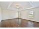 Bright bedroom with hardwood floors, tray ceiling, and recessed lighting at 1302 Shelter Rock Rd, Orlando, FL 32835