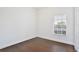 Bright bedroom with hardwood floors and natural light from window at 1302 Shelter Rock Rd, Orlando, FL 32835