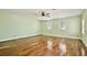 Spacious bedroom features hardwood floors, ceiling fan and bright windows at 1302 Shelter Rock Rd, Orlando, FL 32835