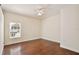 Bedroom with wood floors, ceiling fan, natural light from a window at 1302 Shelter Rock Rd, Orlando, FL 32835