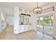 Bright dining room with backyard pool access, tile floors, and large windows for natural light at 1302 Shelter Rock Rd, Orlando, FL 32835