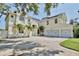 Elegant home with a three-car garage, well-maintained landscaping, and solar panels at 1302 Shelter Rock Rd, Orlando, FL 32835