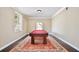 Spacious room featuring a red billiard table, hardwood floors and a window at 1302 Shelter Rock Rd, Orlando, FL 32835