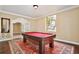 Game room with a billiard table and an ornate rug on hardwood floors at 1302 Shelter Rock Rd, Orlando, FL 32835