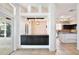 An open-concept kitchen area featuring dark cabinets, tile flooring, and granite countertops at 1302 Shelter Rock Rd, Orlando, FL 32835