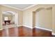 Hardwood floors in the living room viewed from an adjacent common area at 1302 Shelter Rock Rd, Orlando, FL 32835