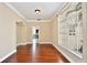 Living room featuring hardwood floors, a large window, and archways at 1302 Shelter Rock Rd, Orlando, FL 32835