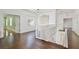 Open loft space with hardwood floors, natural light, and balcony railing at 1302 Shelter Rock Rd, Orlando, FL 32835