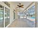 Covered patio featuring ceiling fan and an outdoor pool area at 1302 Shelter Rock Rd, Orlando, FL 32835