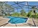 Screened pool area with surrounding trees and seating space at 1302 Shelter Rock Rd, Orlando, FL 32835