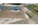 Aerial view of the back exterior, featuring a pergola and newly installed lawn at 13247 Sw 83Rd Cir, Ocala, FL 34473