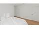Bright bedroom with a large bed, light-colored walls and light wood flooring at 13247 Sw 83Rd Cir, Ocala, FL 34473