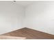 A minimal bedroom features wood flooring, white walls, and a modern aesthetic at 13247 Sw 83Rd Cir, Ocala, FL 34473