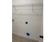 Interior laundry room, equipped with hookups and overhead wire shelving at 13247 Sw 83Rd Cir, Ocala, FL 34473