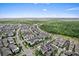 An aerial view showcases the community next to lush green spaces and waterways at 13865 Granger Ave, Orlando, FL 32827