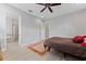 This bright bedroom features hardwood floors and access to the Primary bathroom at 13865 Granger Ave, Orlando, FL 32827