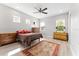 Bedroom with neutral color palette, ceiling fan and wood-look floors at 13865 Granger Ave, Orlando, FL 32827
