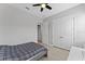 Bedroom with closet, ceiling fan, wood-look floors, and a neutral color palette at 13865 Granger Ave, Orlando, FL 32827