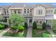 Attractive townhome with a well-maintained front yard, inviting walkway, and charming architectural details at 13865 Granger Ave, Orlando, FL 32827
