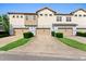 Charming townhome with attached garage and well-manicured landscaping at 13865 Granger Ave, Orlando, FL 32827