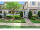 Well-maintained townhome with a lush front yard, mature landscaping, and a private gated courtyard at 13865 Granger Ave, Orlando, FL 32827