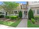Charming townhome with a lush front yard, gated entrance, and a well-manicured landscape adding curb appeal at 13865 Granger Ave, Orlando, FL 32827