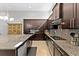 Modern kitchen with stainless steel appliances, granite countertops, and ample cabinet space at 13865 Granger Ave, Orlando, FL 32827