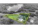 Scenic aerial view of estate with pool, and a serene lake in a lush, treed environment at 1415 Brumley Rd, Chuluota, FL 32766