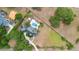 An aerial view of a luxurious home with a pool and a meticulously maintained landscape at 1415 Brumley Rd, Chuluota, FL 32766