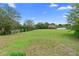 Beautiful oversized grassy lot with mature trees, ready for a new owner to create their dream backyard at 1415 Brumley Rd, Chuluota, FL 32766