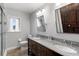 Bathroom featuring a double vanity, granite counters, and a separate glass-enclosed shower at 1415 Brumley Rd, Chuluota, FL 32766